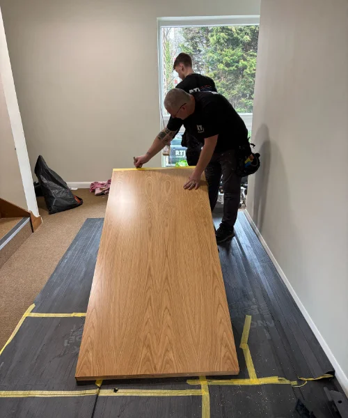 Fire Door Installation Two RTJ employees working and installing a fire door