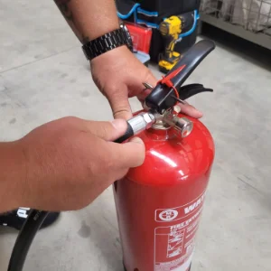 Fire Safety Training Someone holding and operating a fire extinguisher