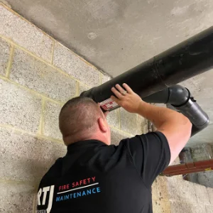 Fire Stopping and Compartmentation Roy of RTJ inspecting pipes