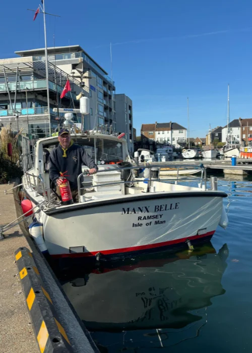 Get in Touch Man on a boat holding a fire extinguisher